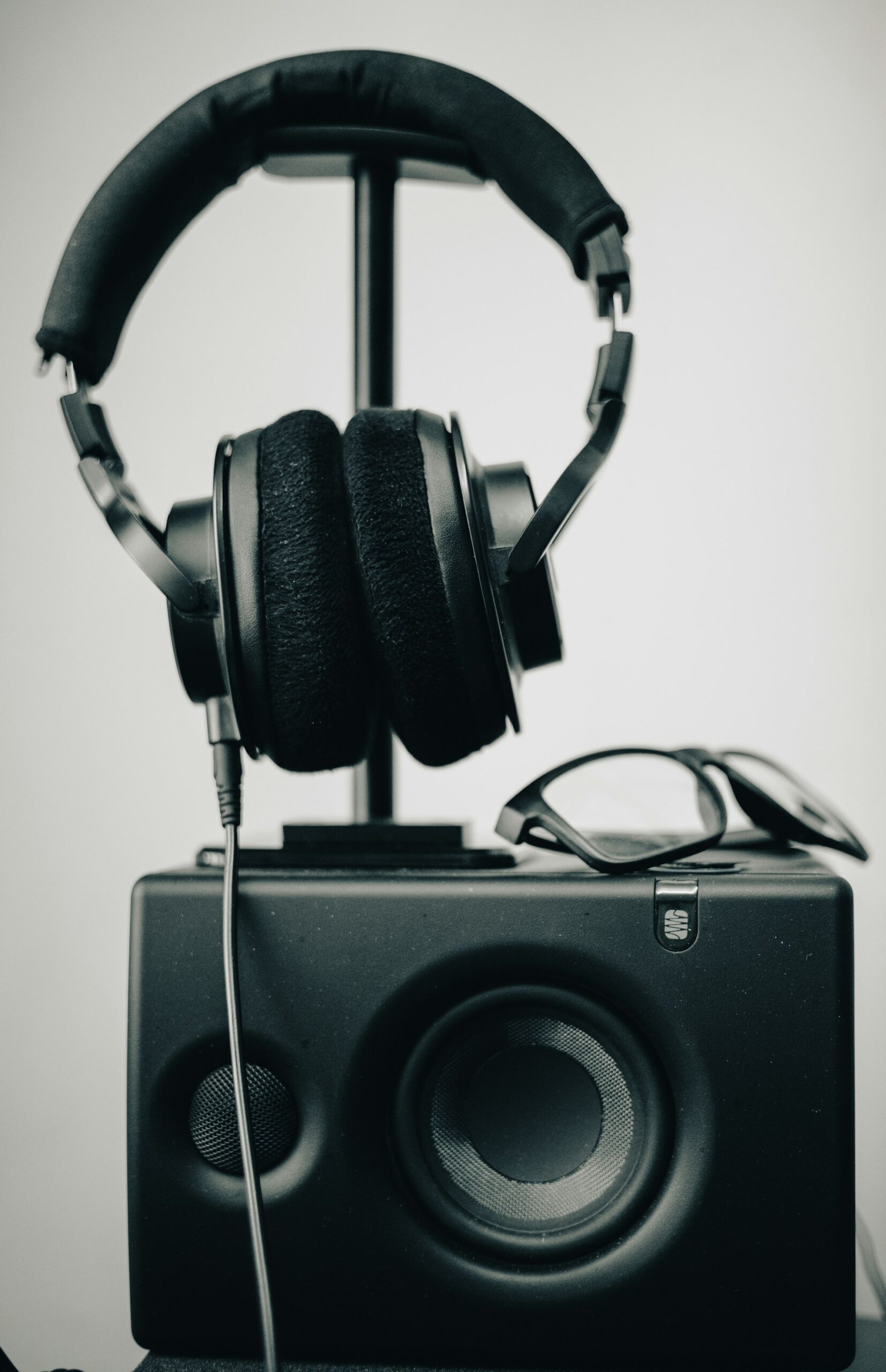 Black headphones on white stand