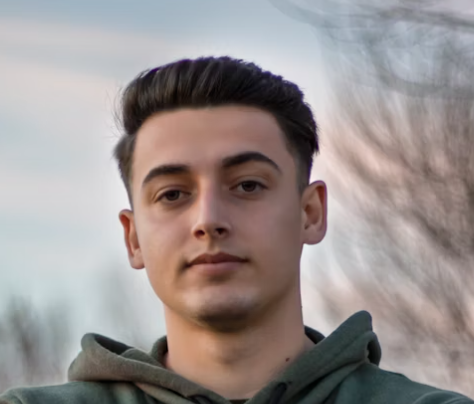 Young man in green hoodie