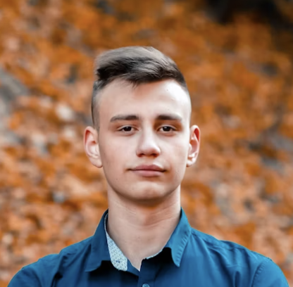 Man in blue shirt outdoors